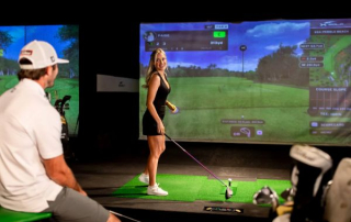 X-Golf Bend makes a great date idea any time of year. Pictured here is a gal approaching the Tee smiling at the guy behind her at the Old Mill District location in Bend, Oregon